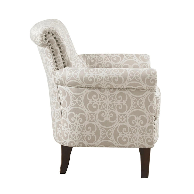 Fauteuil club capitonné avec motif de frettes et clous décoratifs argentés