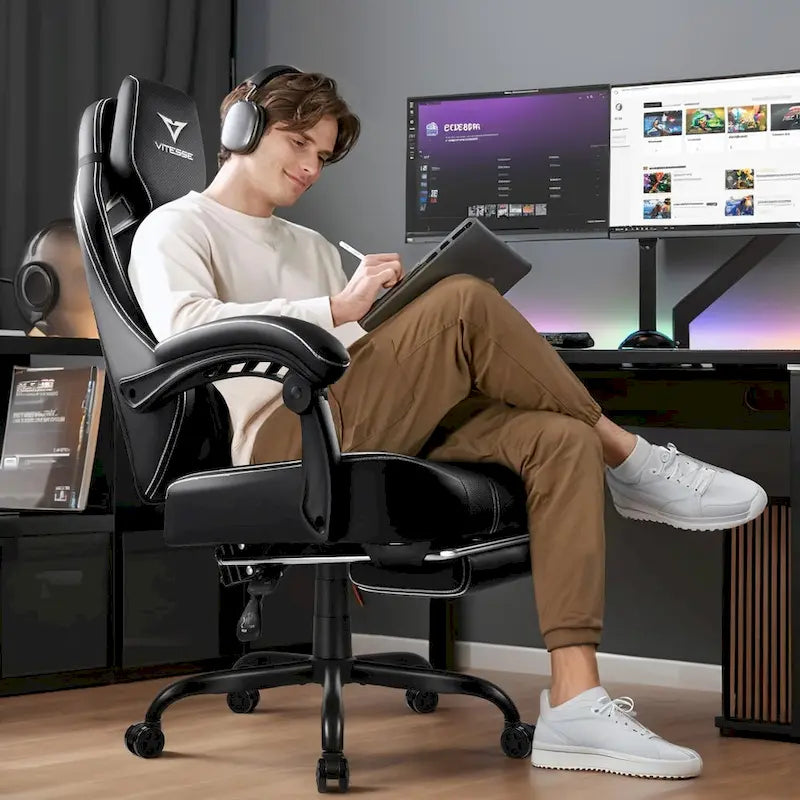Grande et haute chaise de jeu ergonomique noire avec repose-pieds et soutien lombaire