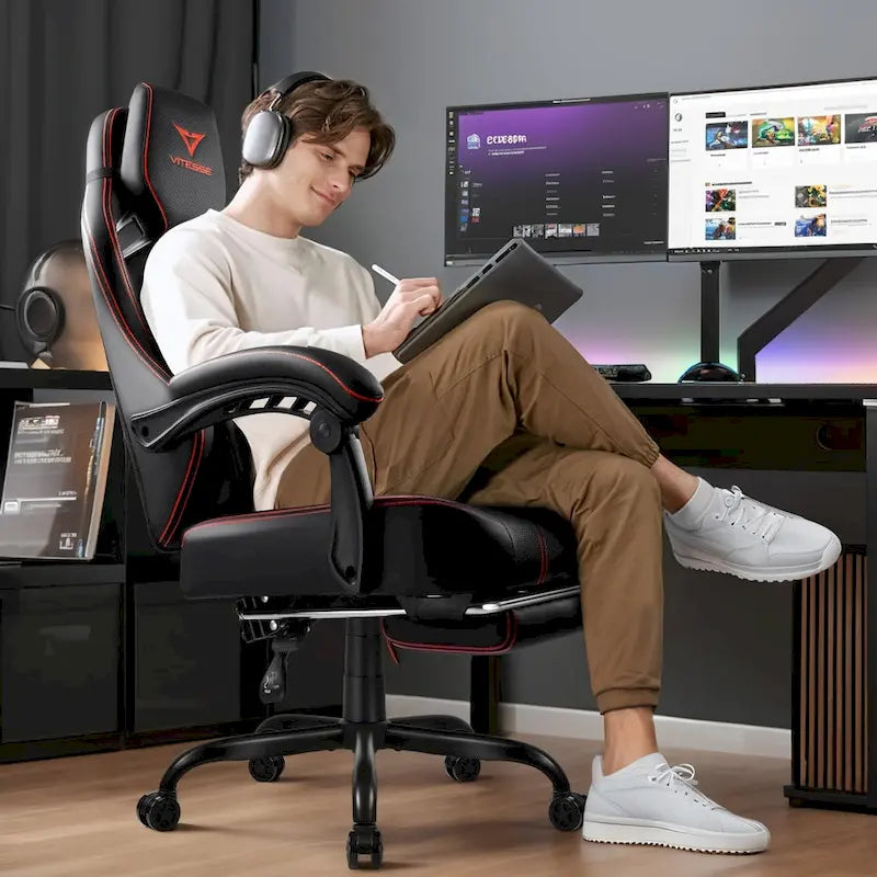 Grande et haute chaise de jeu ergonomique noire avec repose-pieds et soutien lombaire